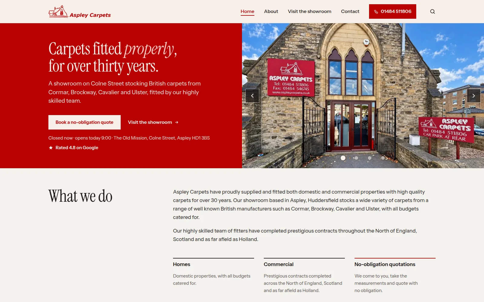 The Aspley Carpets home page: a red panel reading "Carpets fitted properly, for over thirty years", a photo of the stone-built showroom, and buttons to book a quote or visit the showroom.